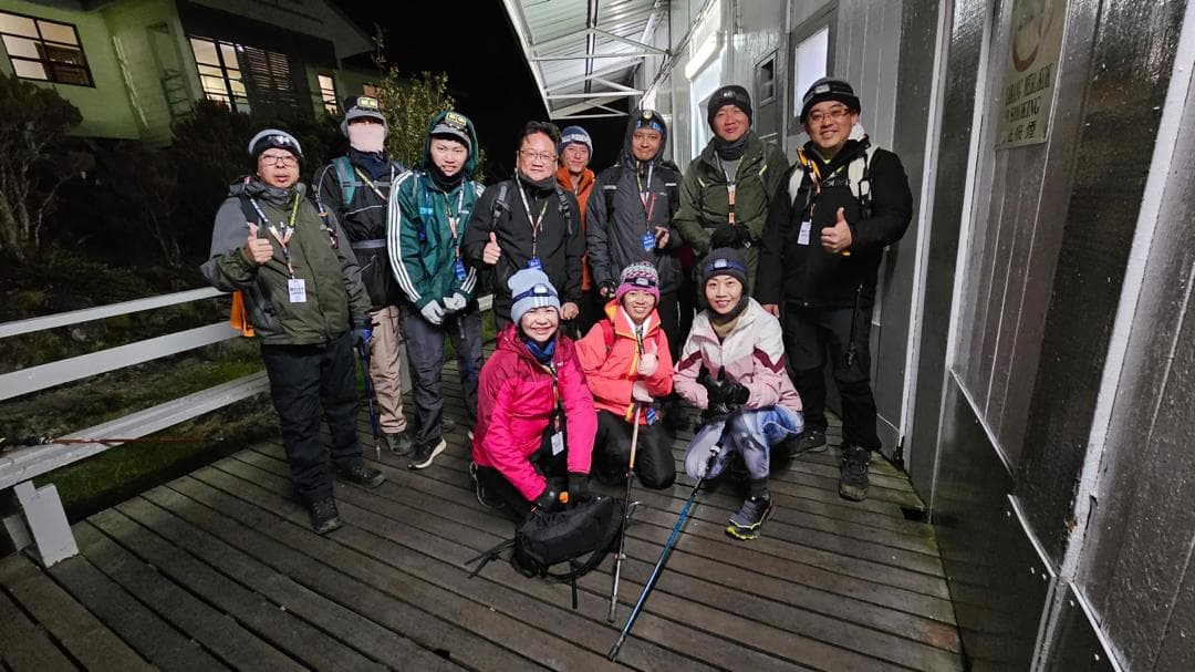 The climbing team gathered at the mountain lodge before the pre-dawn summit ascent.